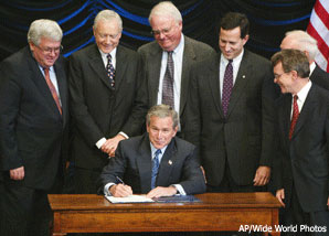 Bush and a bunch of men signing an anti-abortion law