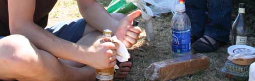 Katrinas friends friend opening a bottle of Corona